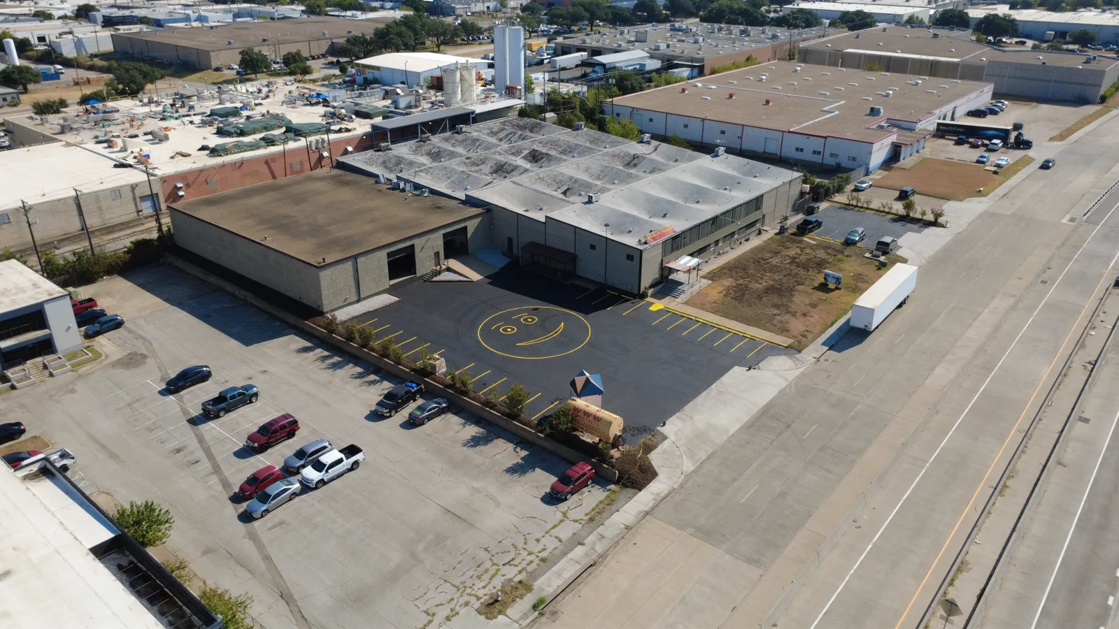 Arlington industrial property aerial photography showing the building, parking and surrounding industrial area