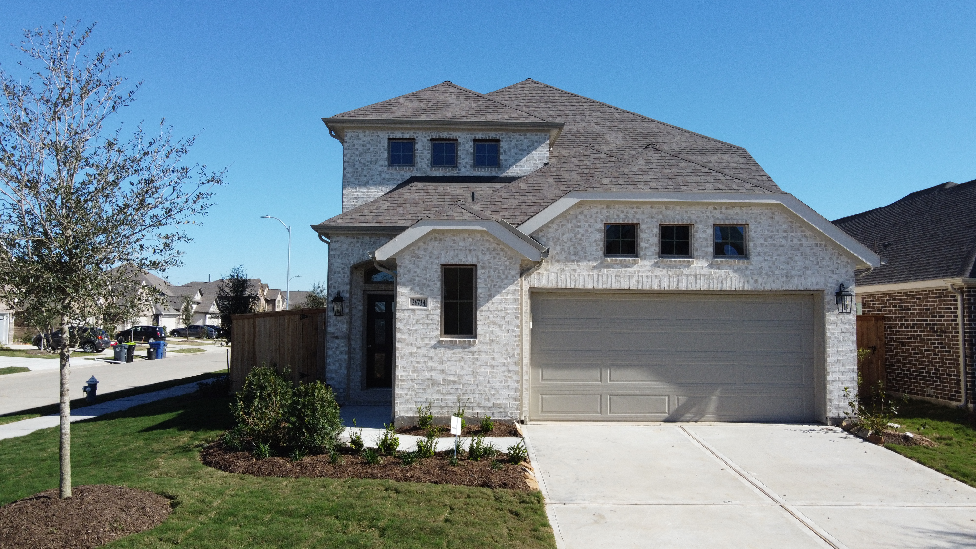 Aerial image of a modern house with greenery